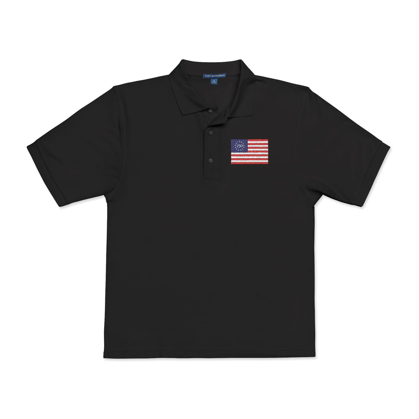 Black polo shirt with a small flag patch on a white background